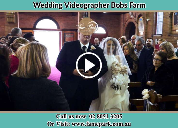 The Bride walking down the aisle with her father Bobs Farm NSW 2316